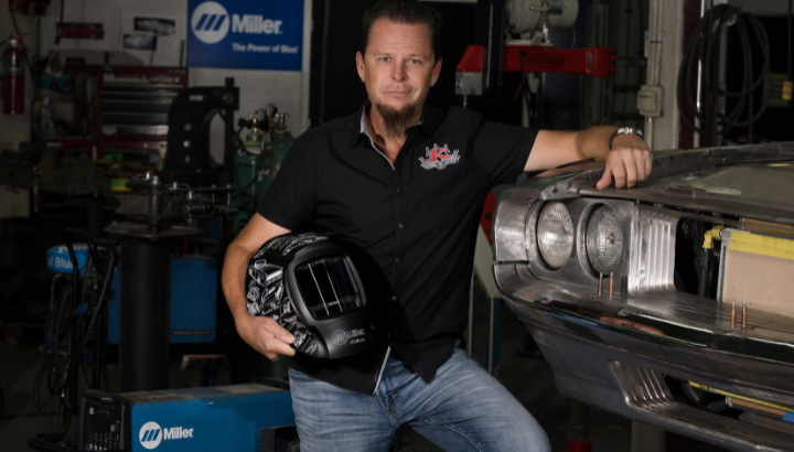 Image of Dave Kindigit with a welding helmet in his hand
