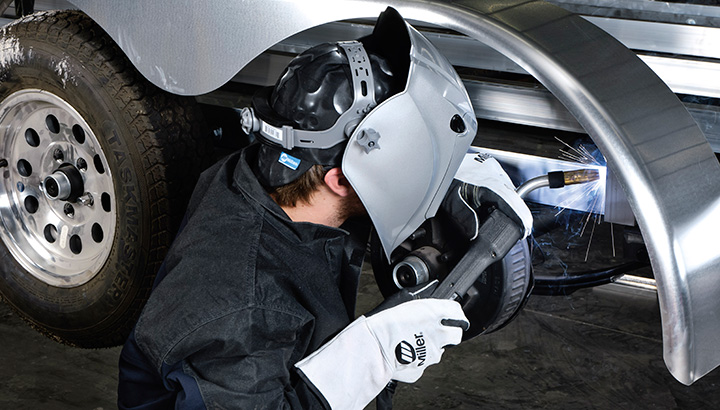Image of welder welding with MIller gloves on