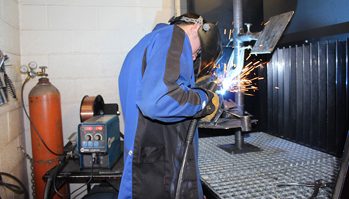 Welding student practicing welds on a coupon