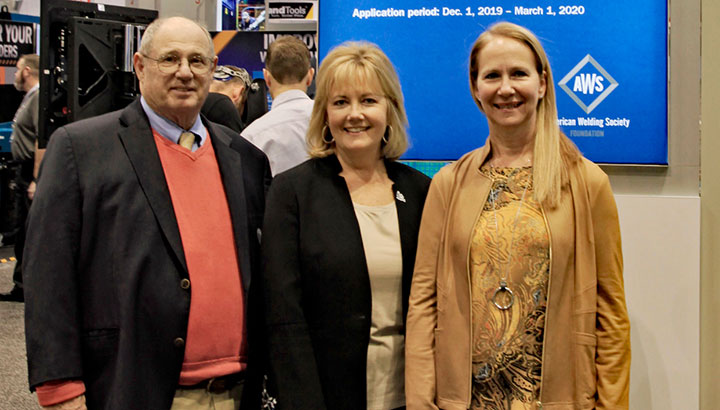 , William Rice, Jr. chairman, AWS Foundation (left) Monica Pfarr, executive director, AWS Foundation (center) and Becky Tuchscherer, group president, Miller (right) in the Miller booth at FABTECH 2019.