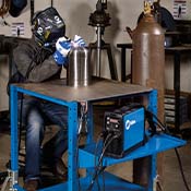 Welder welding with the Miller Maxstar 161