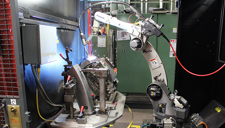 Welding robot welding on fixtured part