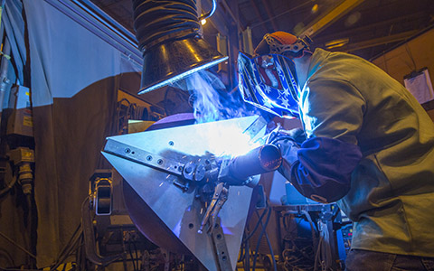 Team Industries employee welding
