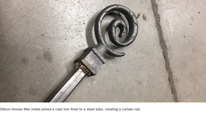 Silicon bronze filler metal joined a cast iron finial to a steel tube, creating a curtain rod.