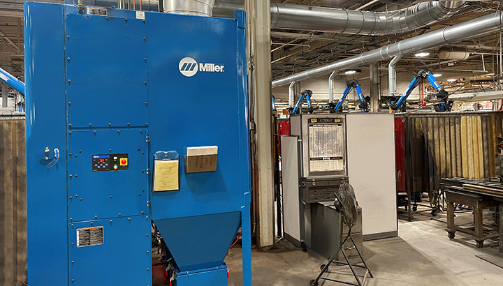 Miller FILTAIR Centralized 12000 System with ZoneFlow fume extraction system installed in a manufacturing environment. 