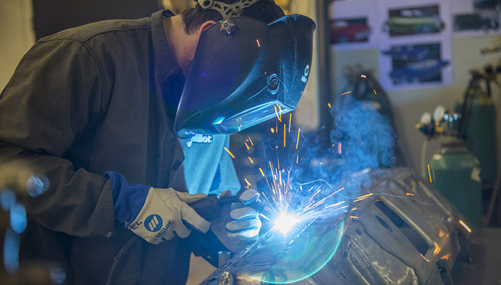 Image of Welder welding a car bumper