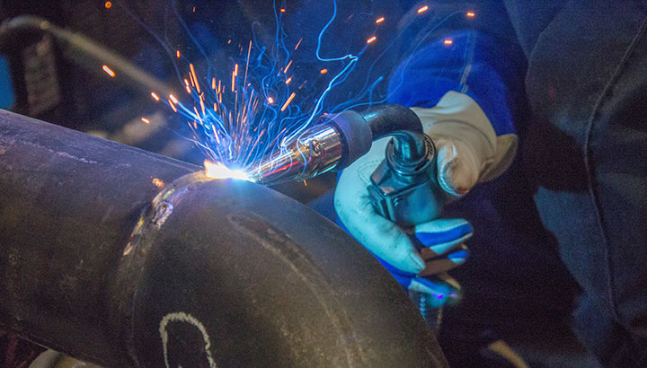 Wire process welding on a pipe