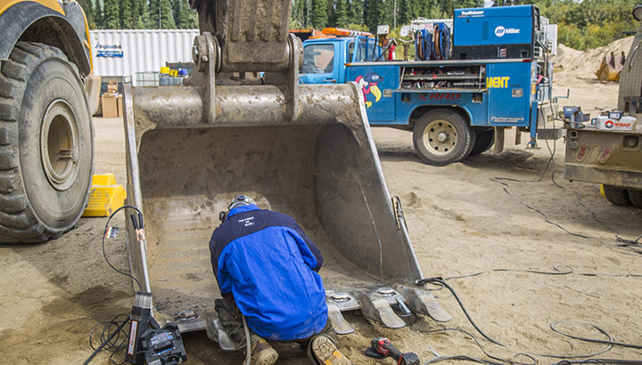 Welding repairs on excavator bucket