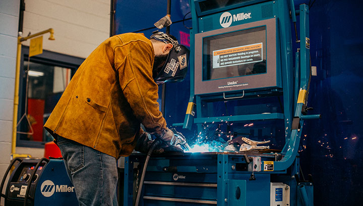 Welding student using Miller LiveArc training system