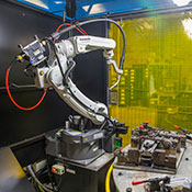 Welding robot in robotic welding cell