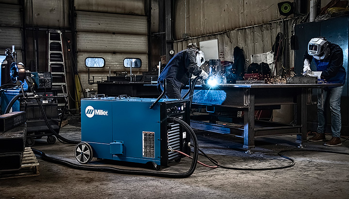 Operators weld in a shop environment with the FILTAIR 215 Fume Extraction System in the foreground 