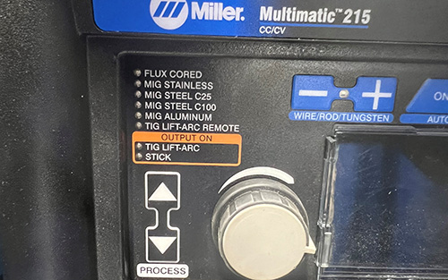 The front panel of the Multimatic® 215 multiprocess welder where operators can choose a MIG process for C25 and C100 gases.