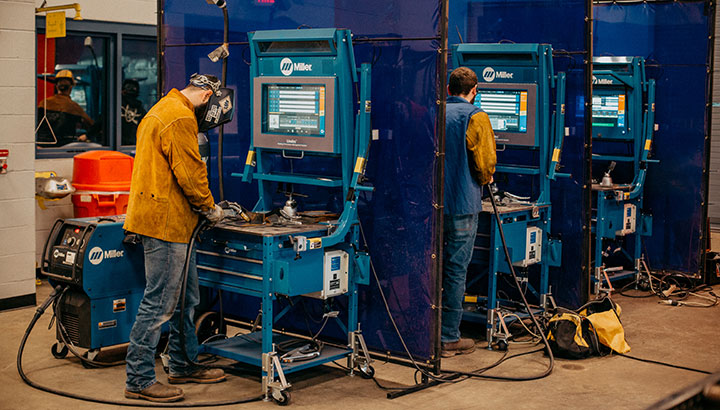 Welding students using Miller LiveArc training system
