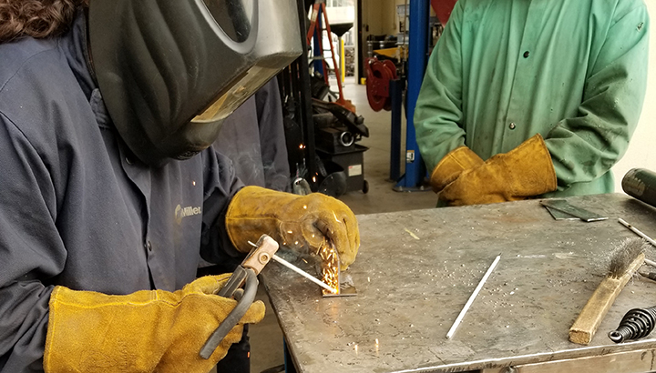 closeup of student stick welding