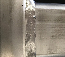 Closeup of a stainless steel MIG weld