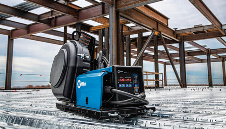 A Miller ArcReach 16 wire feeder pictured on a structural construction jobsite.