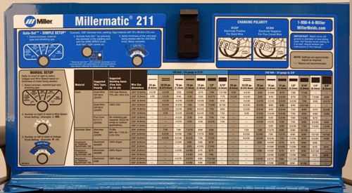 Millermatic 211 settings chart on the inside of the machine cover
