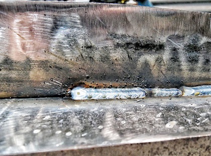Closeup of weld with excessive spatter
