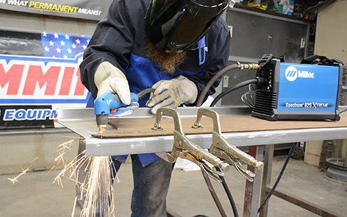 Luke Merrill plasma cutting a running board using a wood template