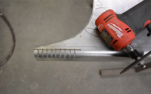 Running board with vertical relief cuts