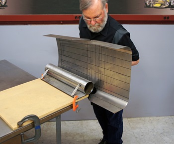 Bending a sheet of metal with a bending machine