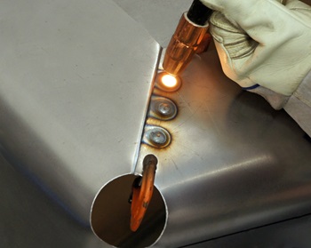 Plug welding a sheet of metal