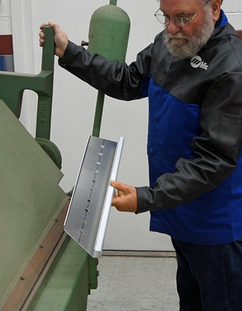 Bending Brake forming a side rail for the table top