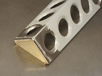 Cap welded onto table leg