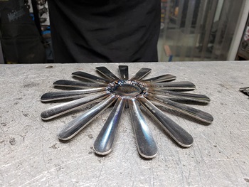 back of welded metal flower