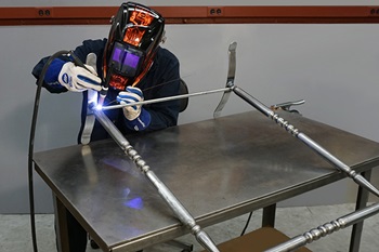 TIG welding the bottom of a stocking holder stand