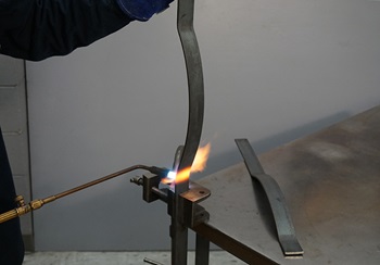 heating up metal bar with oxy-acetylene torch