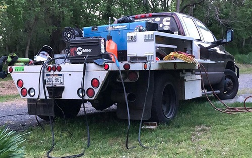 Weld truck with a Miller® wire feeder on the back