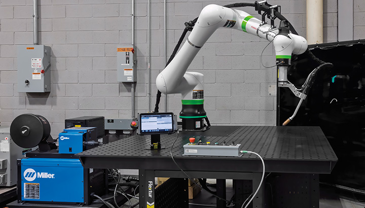 Welding cobot with long-reach arm.