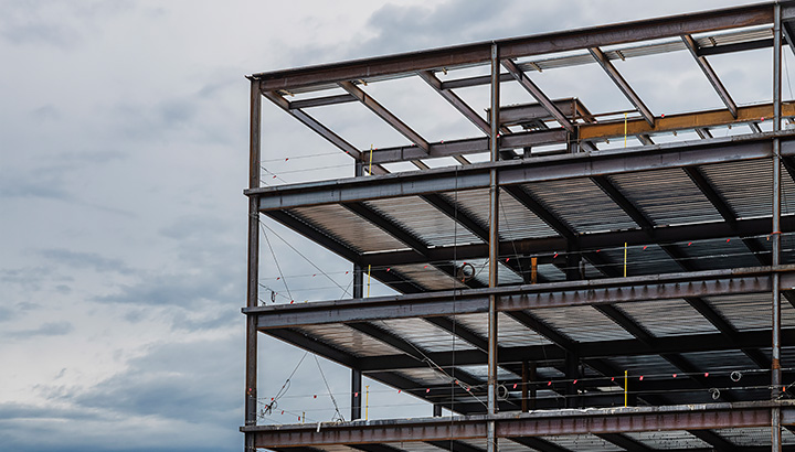 The framing of a structural steel building as it is under construction.