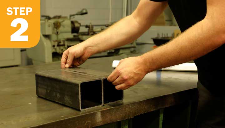 Image of two square steel tubes, 12” in length.