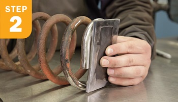 holding a coil up to a bar stock plate