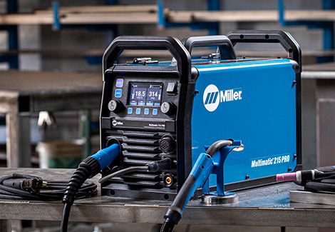 Multimatic 215 PRO on a workbench in a shop environment.