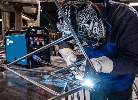 Welder flux-core welding metal tubing with the Millermatic 142 MIG welder for beginners.