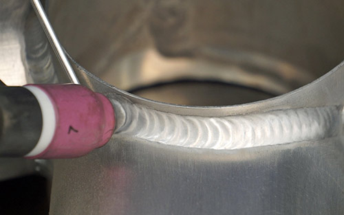 Close-up image of a dime-on-dime weld